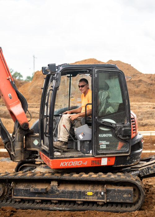 A Pace contractor operates an excavator on a site in Kentuckiana